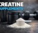 Creatine supplements powder with scoop on gym background